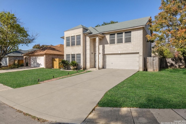 view of front facade featuring a garage and a front lawn