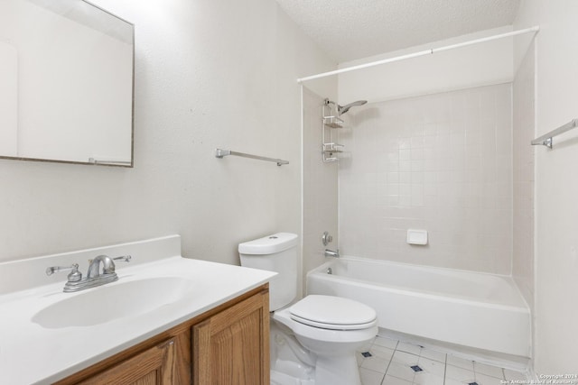 full bathroom featuring vanity, a textured ceiling, tiled shower / bath combo, tile patterned flooring, and toilet