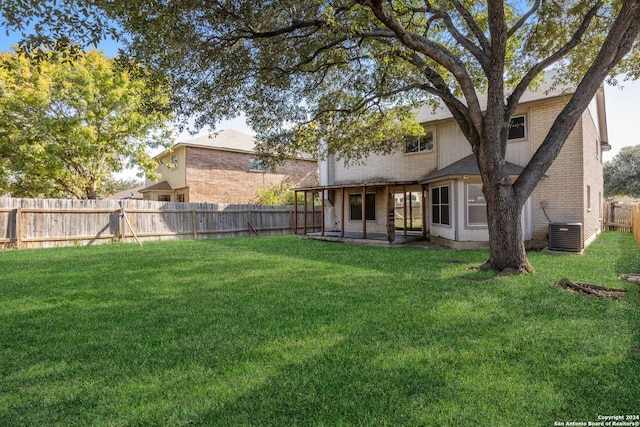 view of yard featuring a patio area and central air condition unit