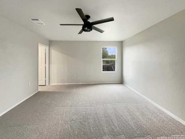 spare room with carpet flooring and ceiling fan