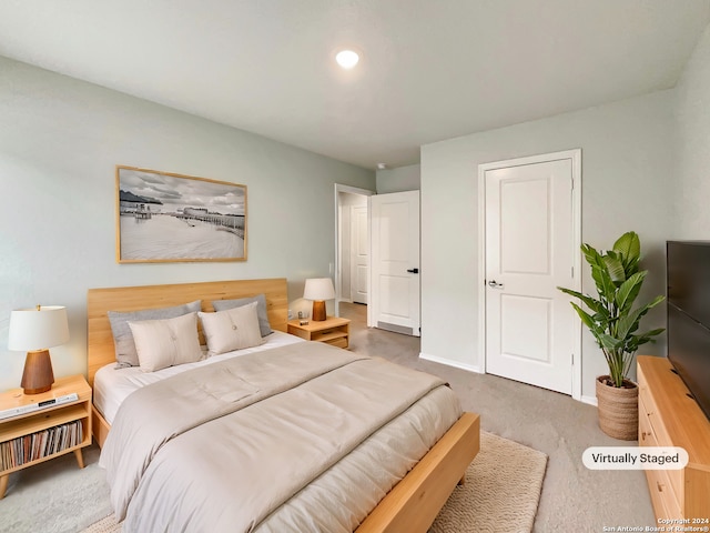 bedroom featuring dark carpet