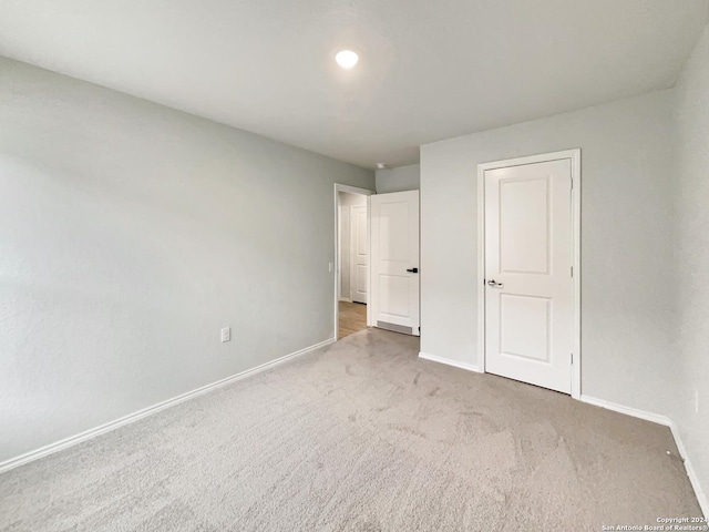 unfurnished bedroom featuring carpet flooring