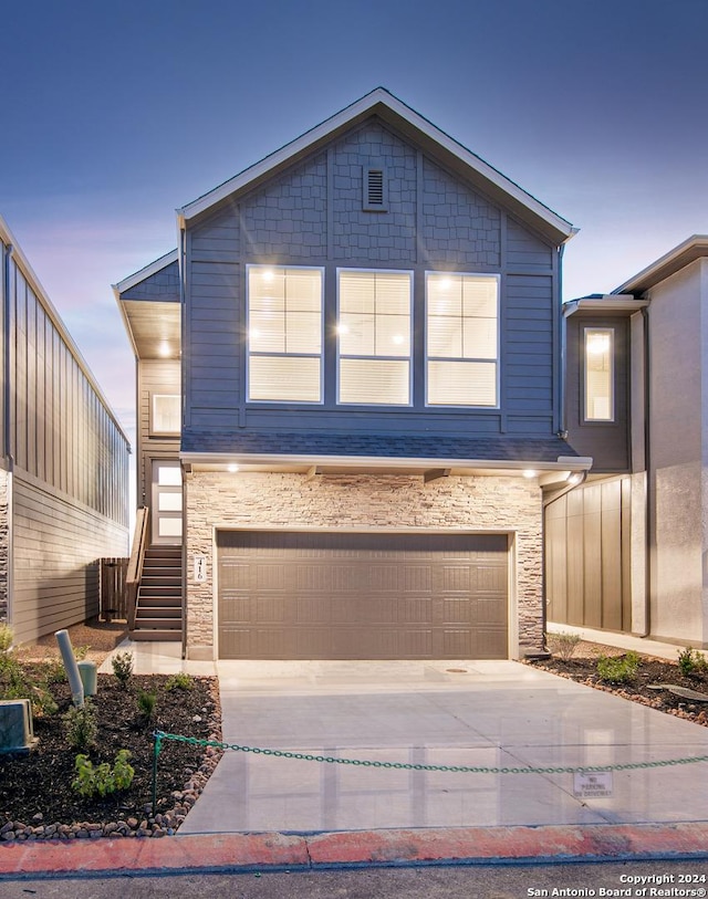 view of front of property with a garage