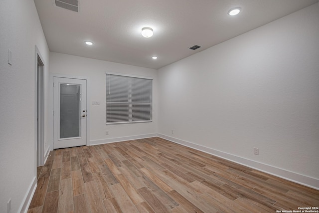 unfurnished room featuring light hardwood / wood-style flooring