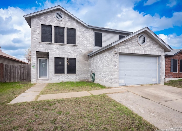 front of property featuring a front yard and a garage