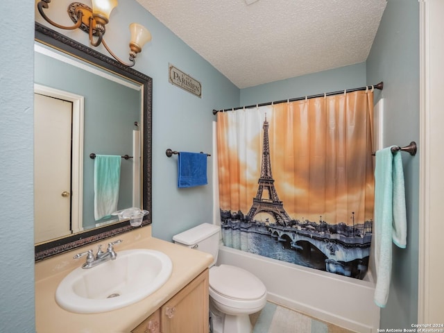 full bathroom with vanity, shower / bath combo, a textured ceiling, and toilet