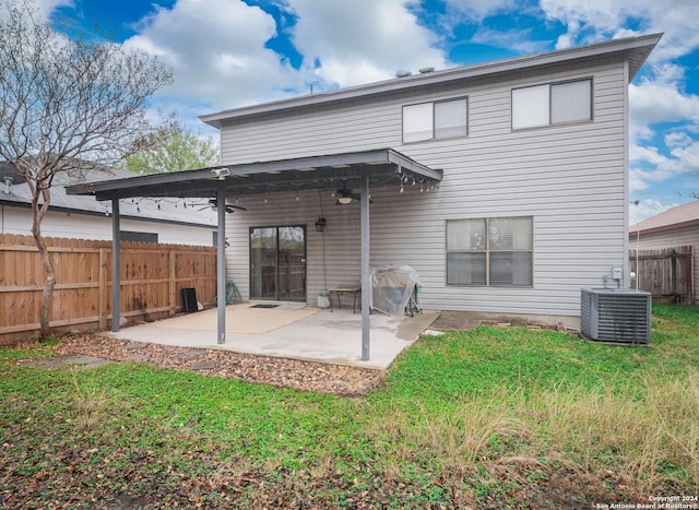 back of property with a patio, central AC, ceiling fan, and a lawn