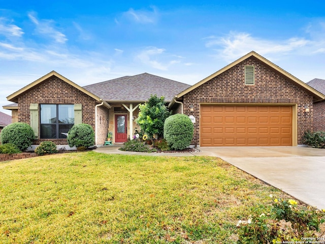 ranch-style home featuring a front yard and a garage