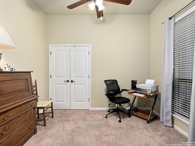 office space with light carpet and ceiling fan