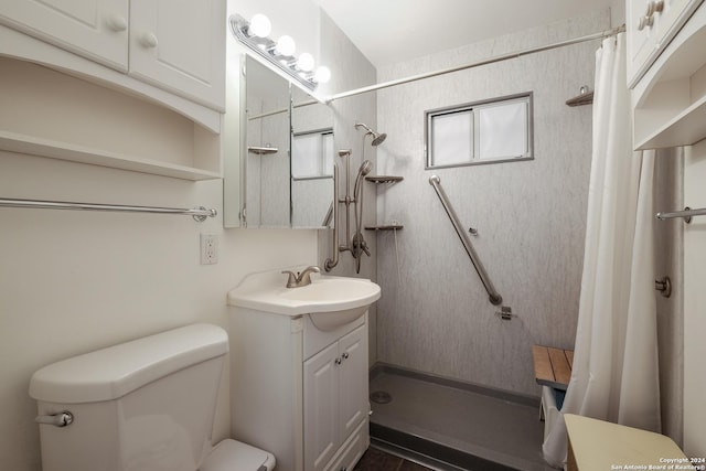 bathroom with a shower with curtain, vanity, and toilet