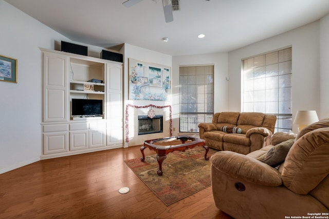 living room with ceiling fan and wood-type flooring