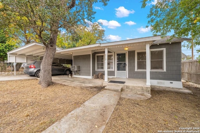 single story home featuring a carport