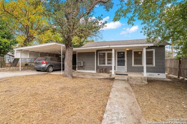 view of front facade featuring a carport and a porch