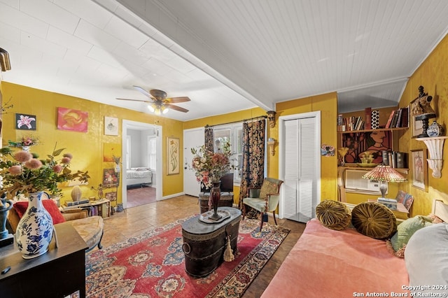 tiled living room featuring ceiling fan