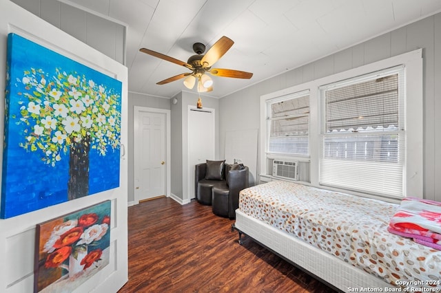 bedroom with ceiling fan, cooling unit, dark wood-type flooring, and ornamental molding