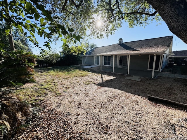 view of side of property featuring a patio area