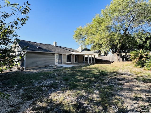 rear view of property featuring a patio