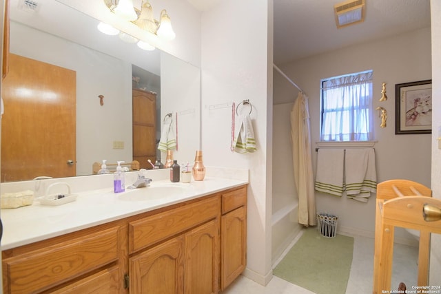 bathroom with a chandelier, vanity, and shower / tub combo with curtain