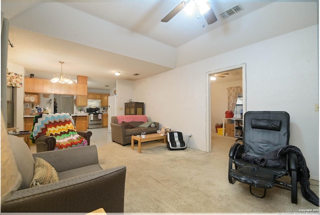 living room with ceiling fan with notable chandelier and light colored carpet