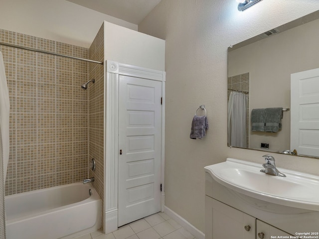 bathroom with tile patterned flooring, vanity, and shower / tub combo