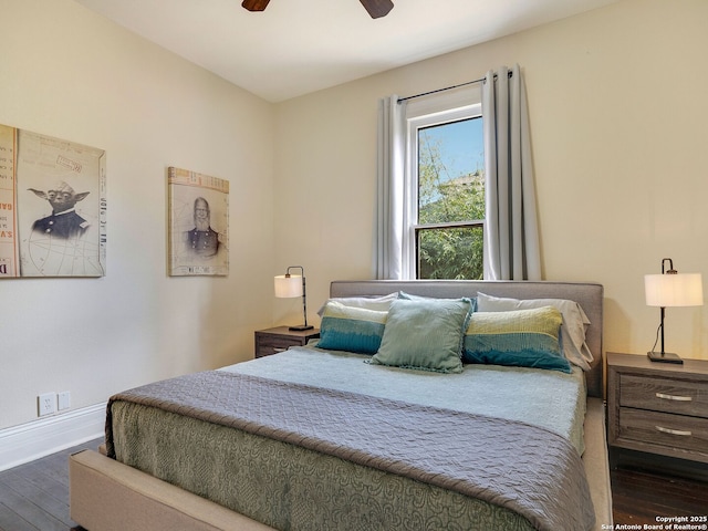 bedroom featuring ceiling fan and dark hardwood / wood-style flooring