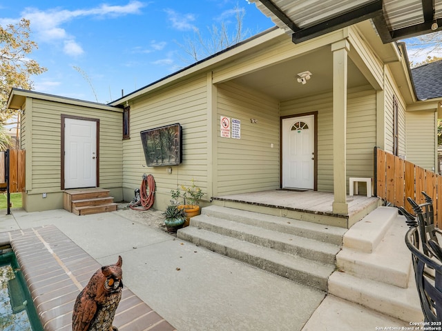 doorway to property with a porch