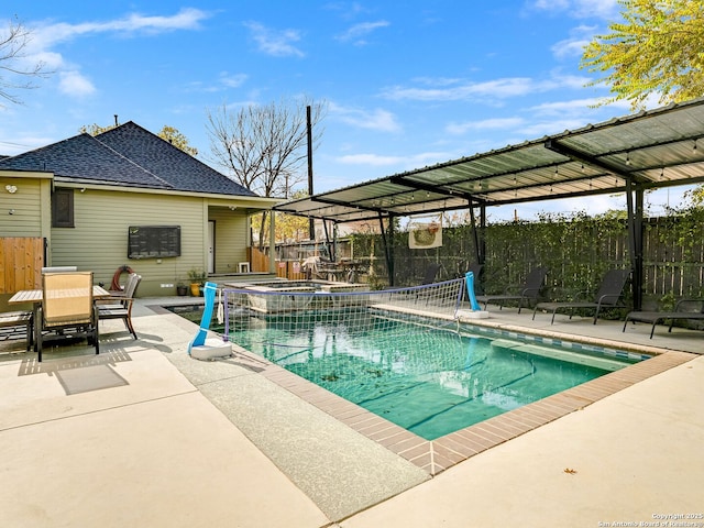 view of pool featuring an in ground hot tub and a patio