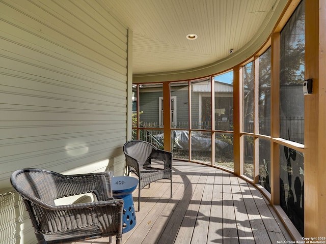 sunroom with a wealth of natural light and wooden ceiling