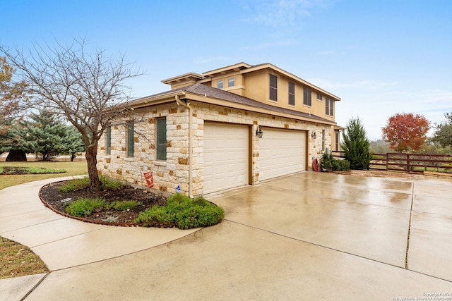 view of side of home featuring a garage