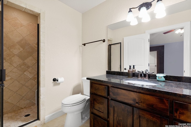 bathroom featuring ceiling fan, walk in shower, tile patterned floors, toilet, and vanity