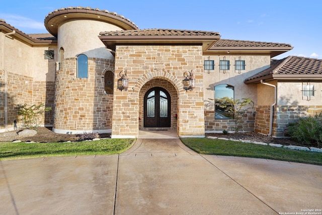 doorway to property featuring french doors