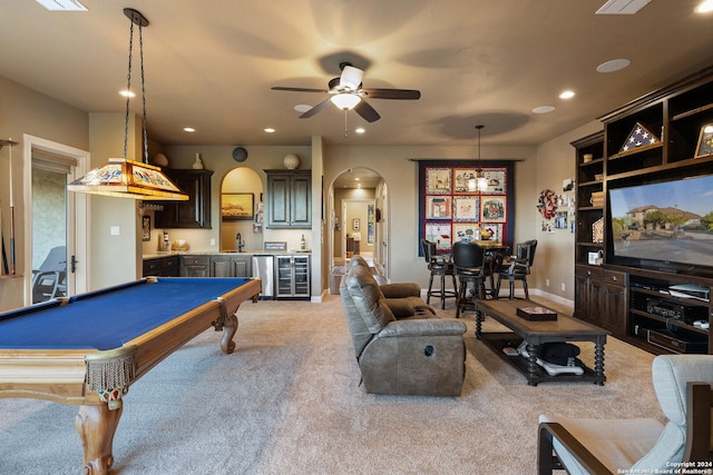 rec room featuring pool table, wet bar, ceiling fan, and carpet