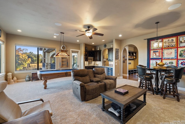 carpeted living room with pool table and ceiling fan