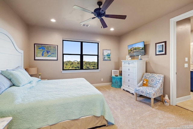 carpeted bedroom with ceiling fan