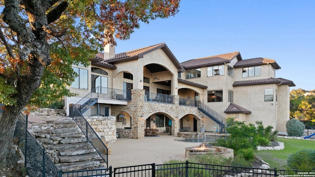 back of house featuring a balcony