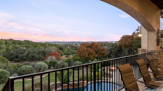 view of balcony at dusk