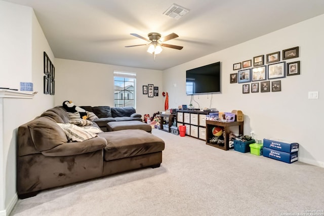 living room with ceiling fan and carpet floors