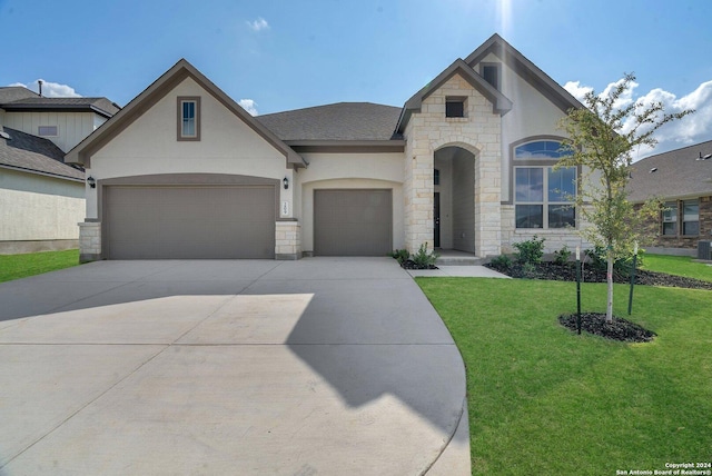 view of front of house featuring a garage and a front yard