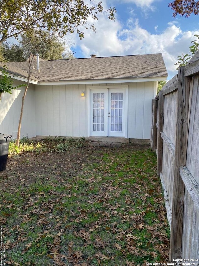 rear view of house featuring french doors