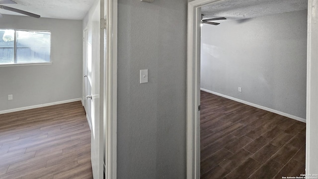 interior space with ceiling fan, hardwood / wood-style floors, and a textured ceiling