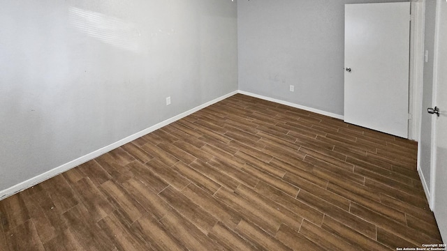 empty room featuring dark hardwood / wood-style floors