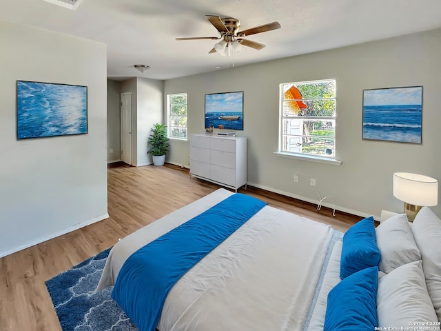 bedroom featuring ceiling fan and wood-type flooring