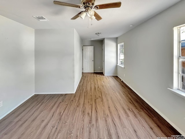 spare room with ceiling fan and light hardwood / wood-style flooring