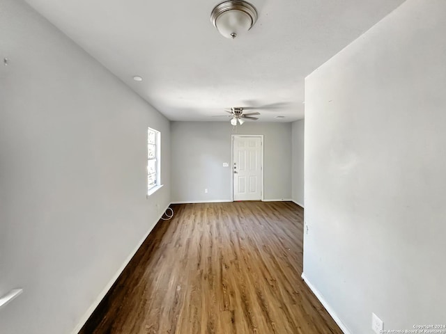 interior space featuring wood-type flooring and ceiling fan