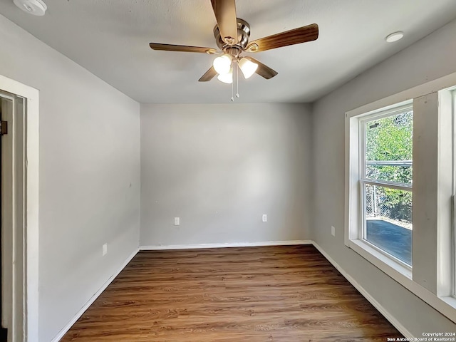 unfurnished room featuring ceiling fan and hardwood / wood-style flooring