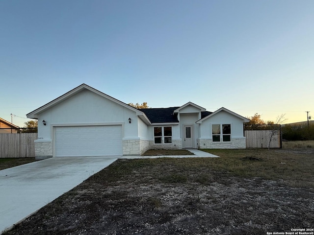 single story home with a garage