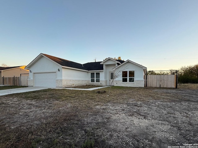 single story home featuring a garage