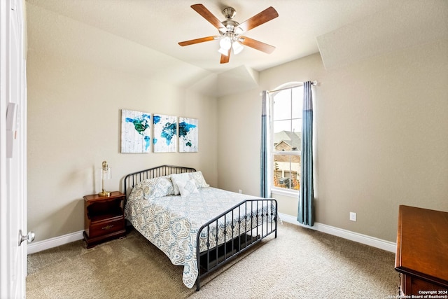 carpeted bedroom with ceiling fan and lofted ceiling