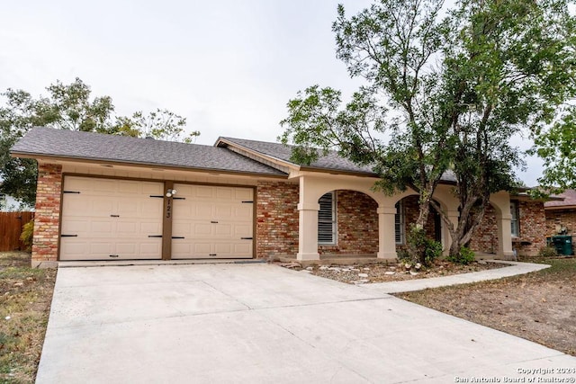 ranch-style home featuring a garage