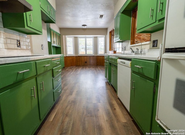 kitchen with white dishwasher, extractor fan, dark hardwood / wood-style floors, and green cabinetry